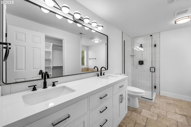 3612 NE 111th St, Vancouver, WA 98686 - bathroom with a stall shower, double vanity, stone tile flooring, toilet, and baseboards