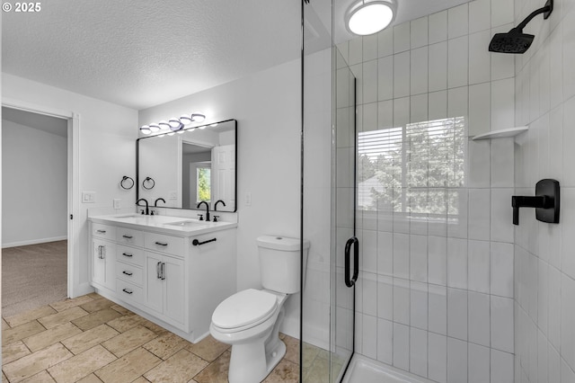 3612 NE 111th St, Vancouver, WA 98686 - bathroom with a stall shower, toilet, a textured ceiling, double vanity, and baseboards