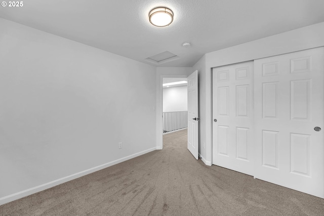 3612 NE 111th St, Vancouver, WA 98686 - unfurnished bedroom with attic access, carpet floors, baseboards, a closet, and a textured ceiling