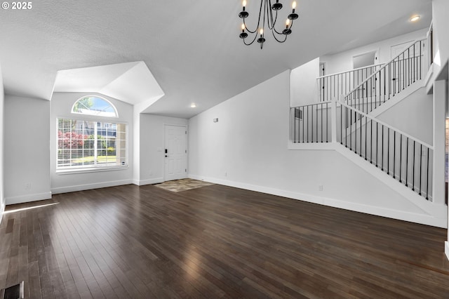 3612 NE 111th St, Vancouver, WA 98686 - unfurnished living room featuring a chandelier, dark wood-style floors, vaulted ceiling, stairs, and baseboards