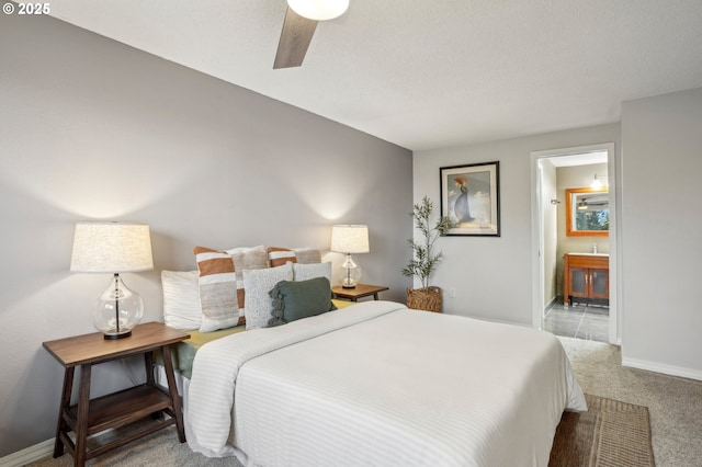 carpeted bedroom featuring connected bathroom