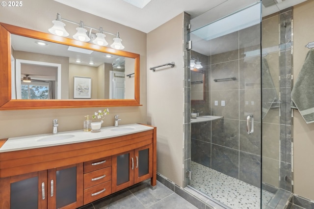 bathroom with vanity, tile patterned floors, and walk in shower