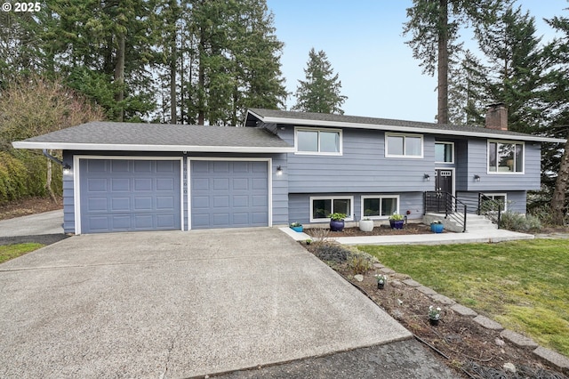 view of front facade with a garage and a front yard