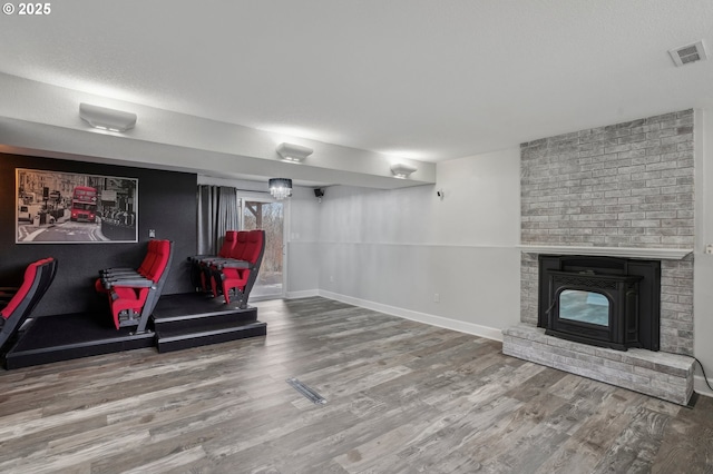 home theater room featuring hardwood / wood-style floors