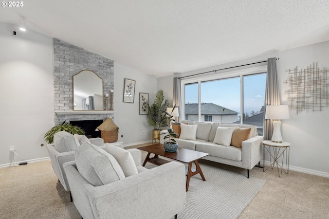 carpeted living room featuring lofted ceiling, a brick fireplace, and a textured ceiling