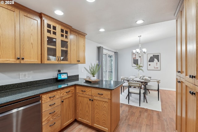 kitchen with lofted ceiling, dishwasher, hanging light fixtures, light hardwood / wood-style floors, and kitchen peninsula