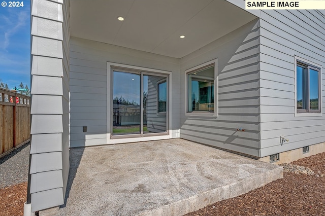 view of patio / terrace featuring fence