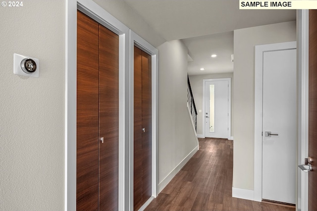 hallway with recessed lighting, dark wood-style flooring, baseboards, and stairs