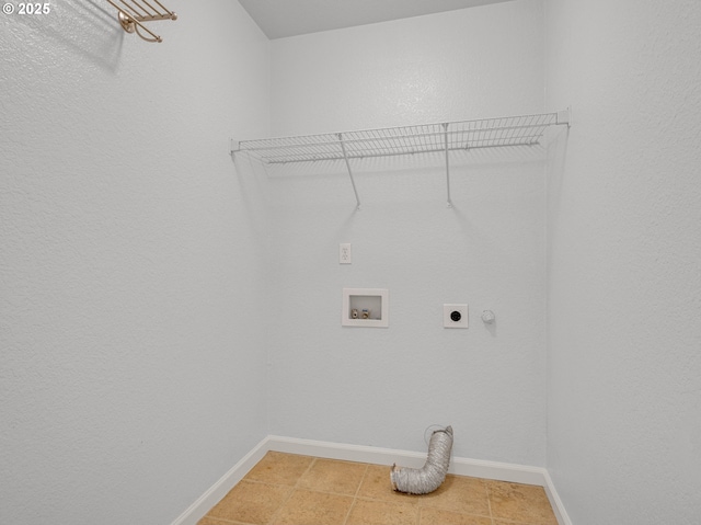 laundry area featuring laundry area, baseboards, tile patterned floors, hookup for a washing machine, and hookup for an electric dryer