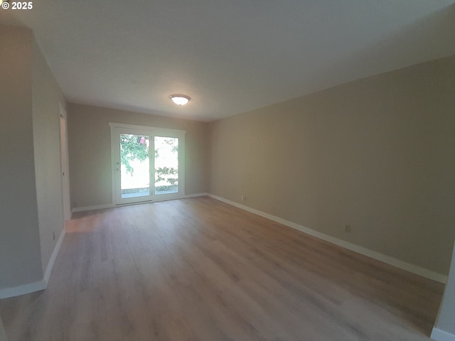 4810 SW 48th Ct, Lincoln City, OR 97367 - spare room with light wood-style flooring and baseboards