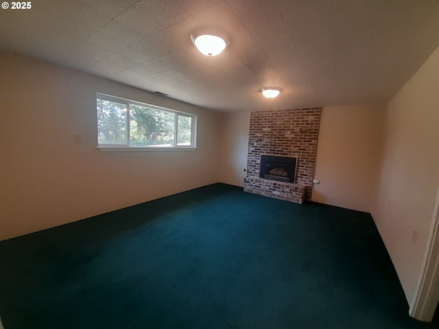 4810 SW 48th Ct, Lincoln City, OR 97367 - unfurnished living room with a fireplace and dark carpet