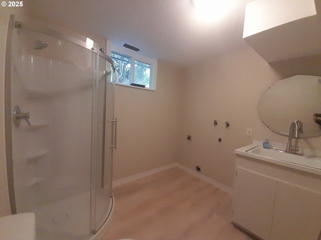 4810 SW 48th Ct, Lincoln City, OR 97367 - bathroom with a shower stall, vanity, toilet, and wood finished floors
