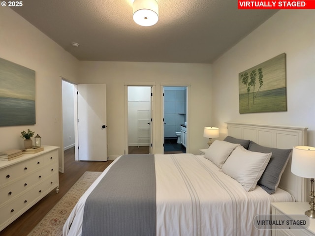 1916 SW 6th St, Battle Ground, WA 98604 - bedroom with dark wood-type flooring, connected bathroom, and a textured ceiling