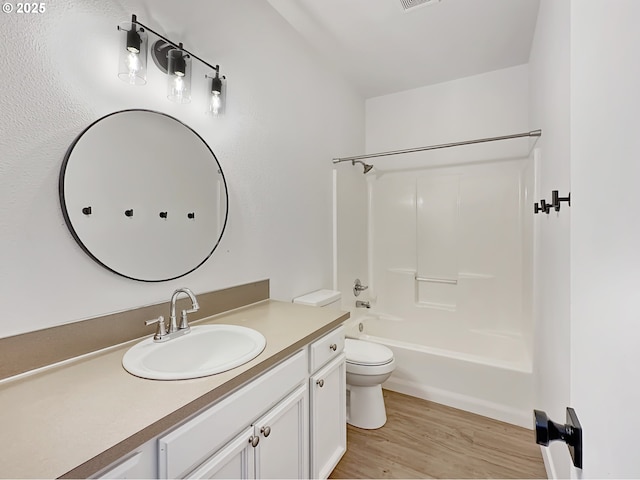 1916 SW 6th St, Battle Ground, WA 98604 - bathroom with vanity, wood finished floors, and washtub / shower combination