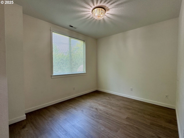 1916 SW 6th St, Battle Ground, WA 98604 - empty room with plenty of natural light and dark wood finished floors