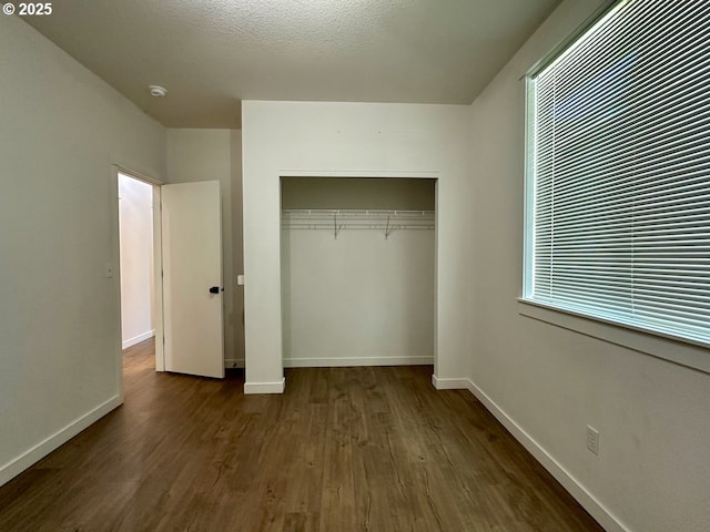 1916 SW 6th St, Battle Ground, WA 98604 - unfurnished bedroom with dark wood-style floors and a closet