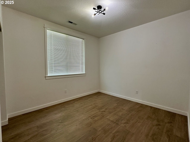 1916 SW 6th St, Battle Ground, WA 98604 - unfurnished room with dark wood finished floors and baseboards