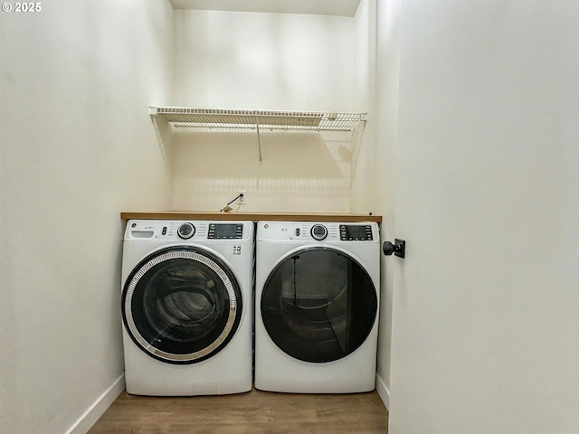 1916 SW 6th St, Battle Ground, WA 98604 - washroom featuring washer and clothes dryer and wood finished floors