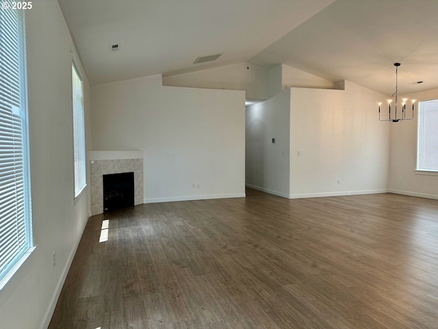 1916 SW 6th St, Battle Ground, WA 98604 - unfurnished living room with a chandelier, dark wood-style floors, a tile fireplace, and vaulted ceiling