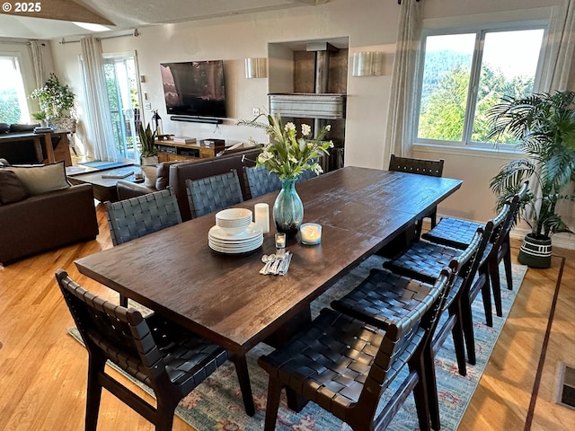 dining space featuring light wood finished floors