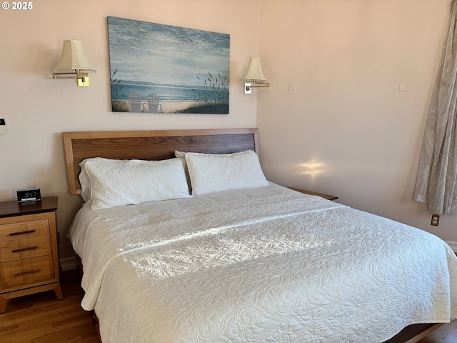 bedroom with wood finished floors