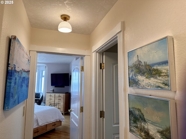 35445 Topping Rd, Pacific City, OR 97135 - hall featuring wood finished floors and a textured ceiling