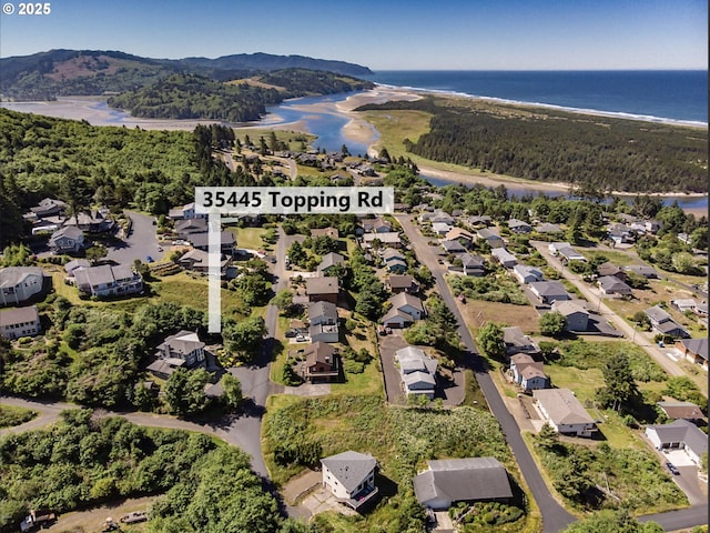 bird's eye view featuring a residential view and a water view