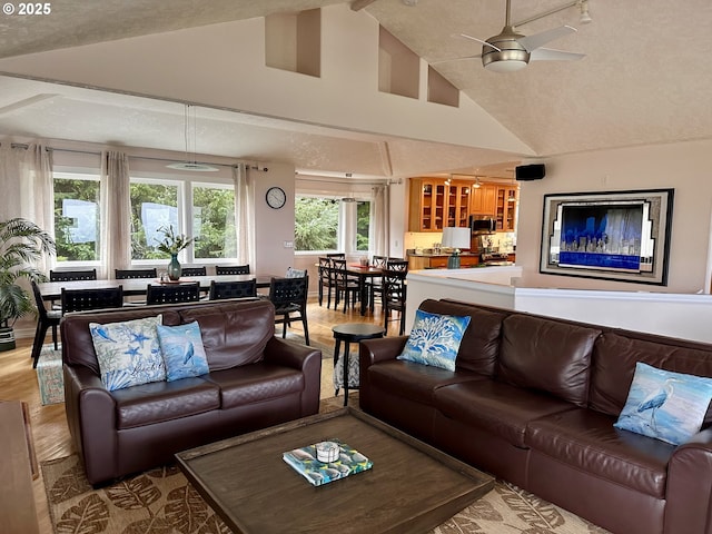 35445 Topping Rd, Pacific City, OR 97135 - living room featuring wood finished floors, a ceiling fan, and high vaulted ceiling