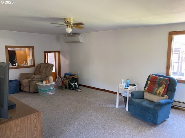 1223 NE Locust St, Oakland, OR 97462 - sitting room with a wall mounted AC, carpet flooring, a ceiling fan, and baseboards