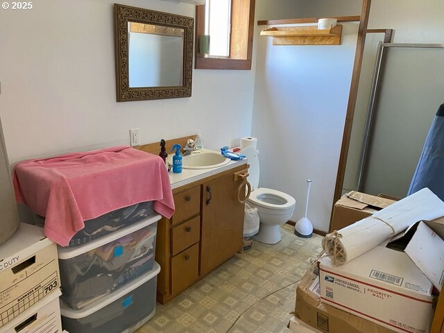 1223 NE Locust St, Oakland, OR 97462 - full bath with vanity, toilet, and an enclosed shower