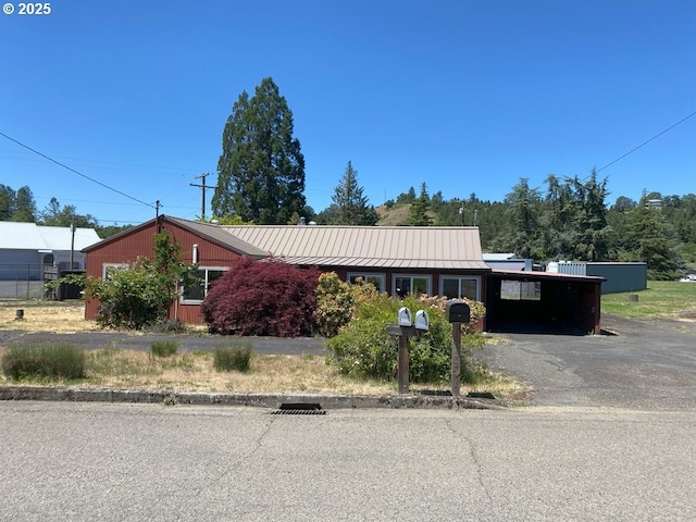 1223 NE Locust St, Oakland, OR 97462 - view of front of property with driveway, a standing seam roof, a carport, and metal roof