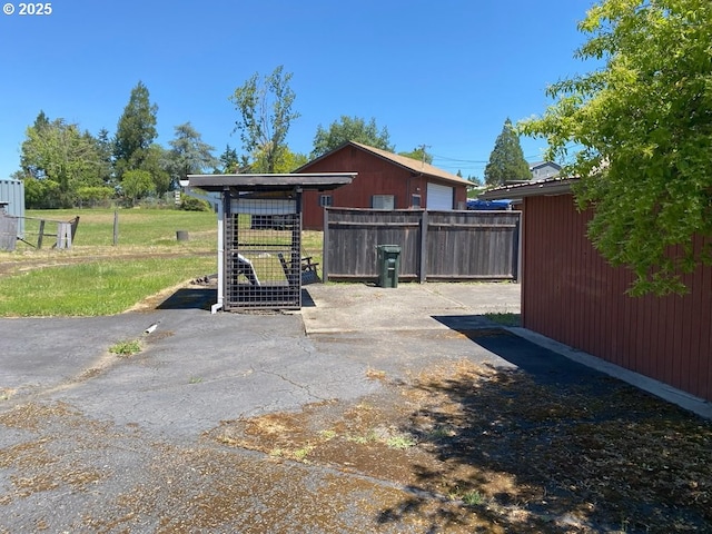 1223 NE Locust St, Oakland, OR 97462 - view of patio / terrace featuring an outbuilding