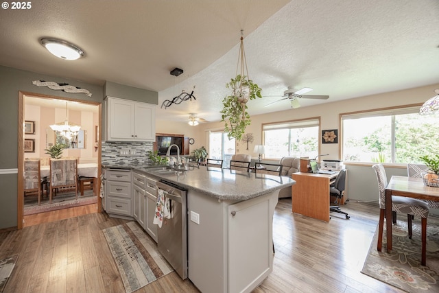 4405 NE 29th Ave, Vancouver, WA 98663 - kitchen with dishwasher, a textured ceiling, light wood-style floors, a chandelier, and open floor plan