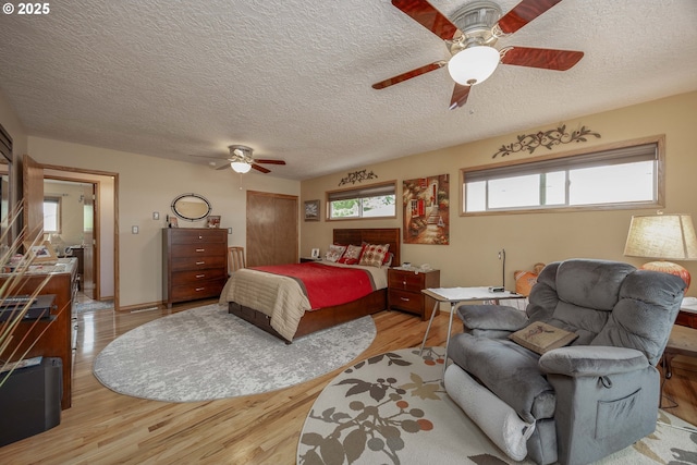 4405 NE 29th Ave, Vancouver, WA 98663 - bedroom featuring wood finished floors, a textured ceiling, and a ceiling fan