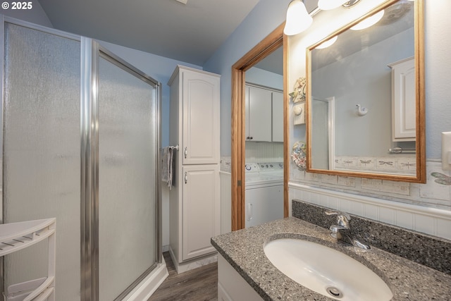 4405 NE 29th Ave, Vancouver, WA 98663 - bathroom with a shower stall, vanity, wood finished floors, and washer and dryer