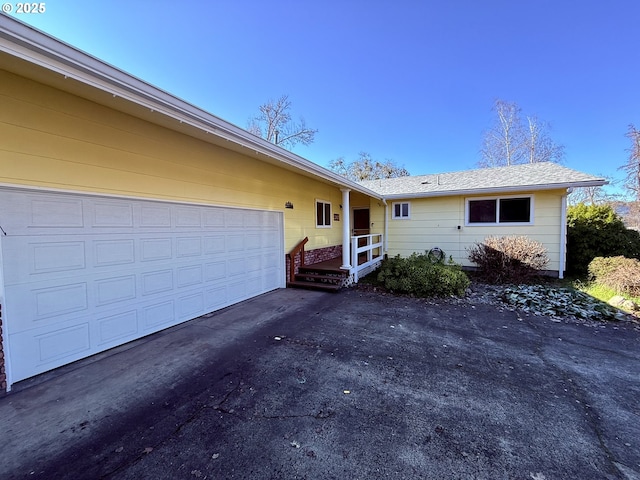 ranch-style home featuring a garage