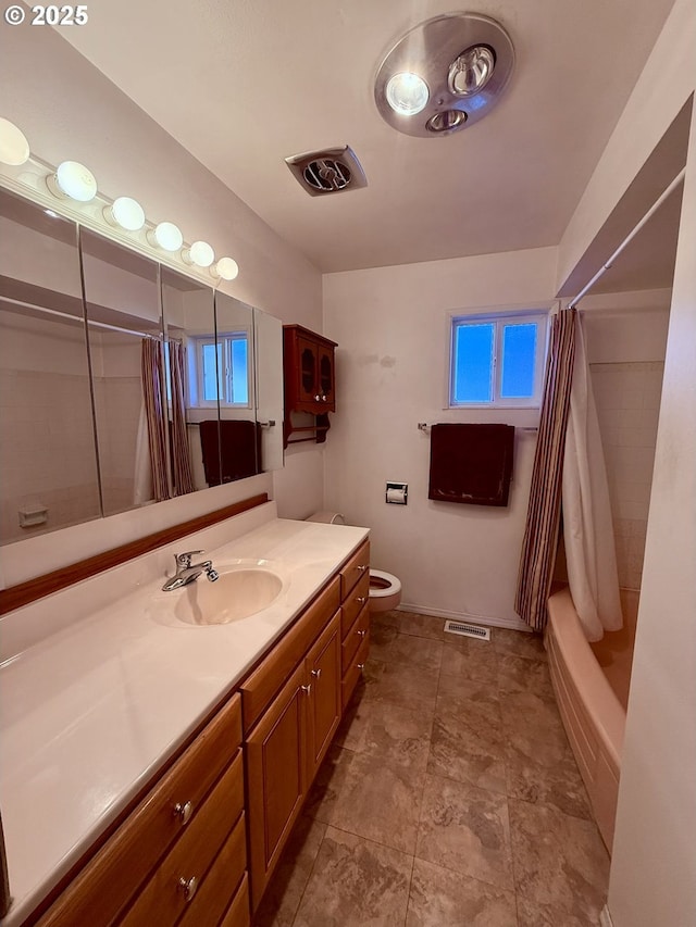 full bathroom featuring vanity, toilet, and shower / bath combo