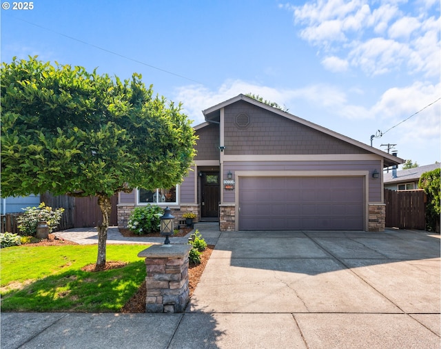 229 N 6th St, Carlton, OR 97111 - view of front facade with stone siding, driveway, and an attached garage
