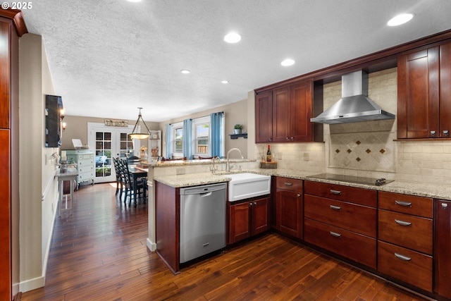 229 N 6th St, Carlton, OR 97111 - kitchen featuring stainless steel dishwasher, wall chimney exhaust hood, black electric stovetop, a peninsula, and dark wood finished floors