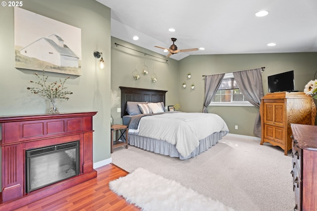 229 N 6th St, Carlton, OR 97111 - bedroom featuring recessed lighting, vaulted ceiling, wood finished floors, a glass covered fireplace, and ceiling fan