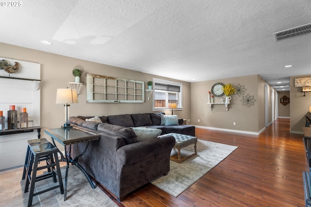 229 N 6th St, Carlton, OR 97111 - living area featuring a textured ceiling, hardwood / wood-style floors, and recessed lighting