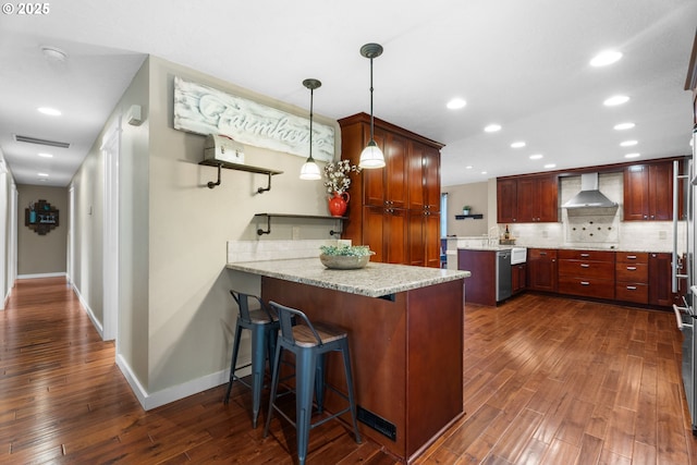 229 N 6th St, Carlton, OR 97111 - kitchen with wall chimney range hood, dark wood finished floors, a peninsula, dishwasher, and tasteful backsplash