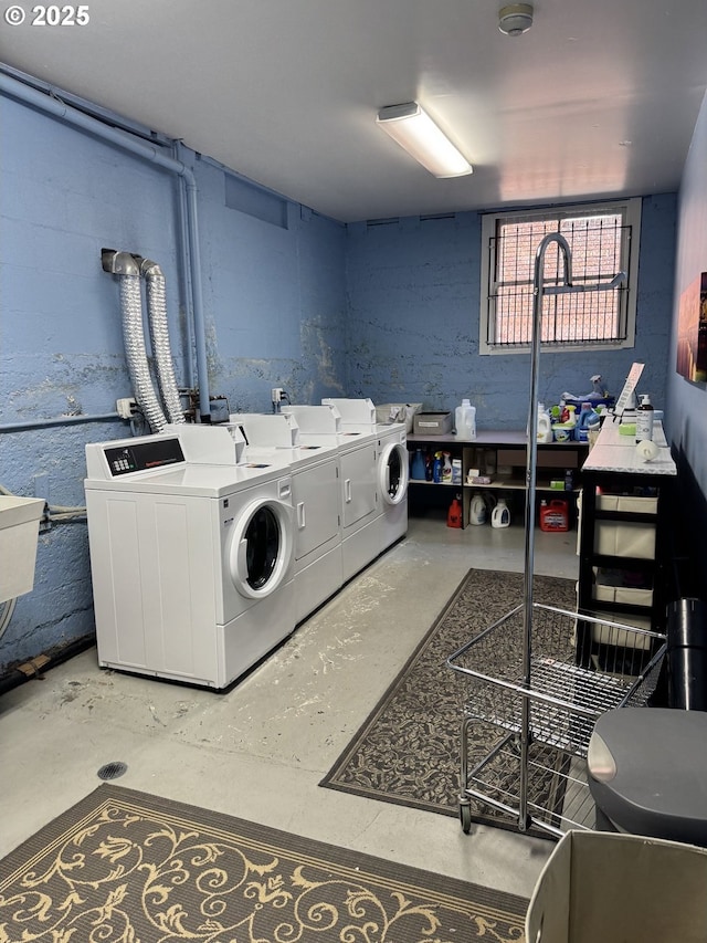 2127 NW Irving St # 202, Portland, OR 97210 - laundry area featuring washer and clothes dryer and a sink