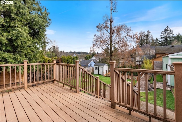 wooden terrace with a shed and an outdoor structure