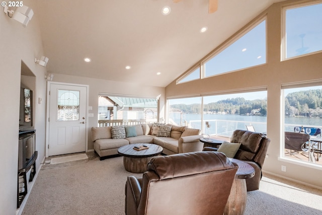 1508 NE Lake Dr, Lincoln City, OR 97367 - carpeted living room featuring a water view, plenty of natural light, and high vaulted ceiling