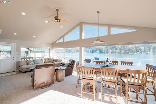 1508 NE Lake Dr, Lincoln City, OR 97367 - dining room featuring high vaulted ceiling, light colored carpet, and a water view