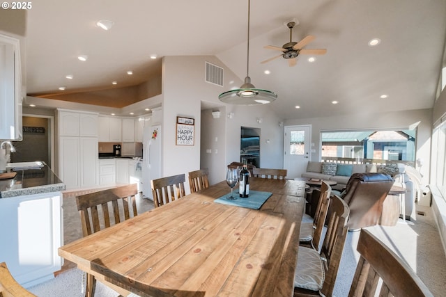 1508 NE Lake Dr, Lincoln City, OR 97367 - dining room with high vaulted ceiling, sink, and ceiling fan