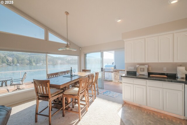 1508 NE Lake Dr, Lincoln City, OR 97367 - sunroom / solarium featuring a water view and lofted ceiling