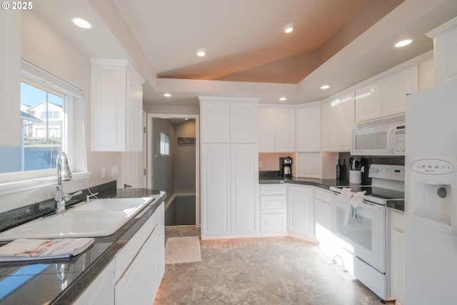 1508 NE Lake Dr, Lincoln City, OR 97367 - kitchen with white cabinetry, lofted ceiling, sink, and white appliances