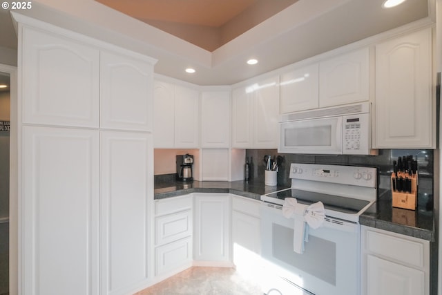 1508 NE Lake Dr, Lincoln City, OR 97367 - kitchen with white appliances, decorative backsplash, and white cabinets